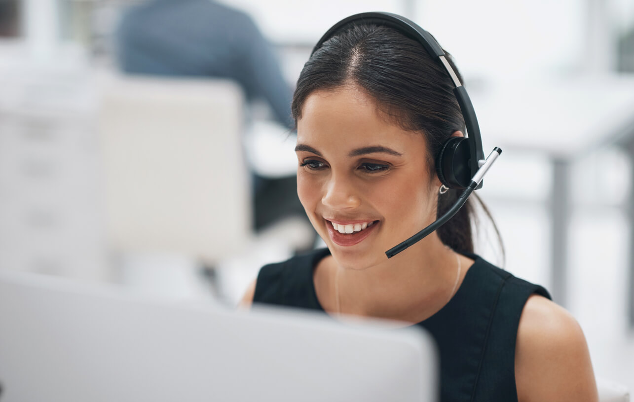 Friendly HS Dumpsters customer service representative answering a call